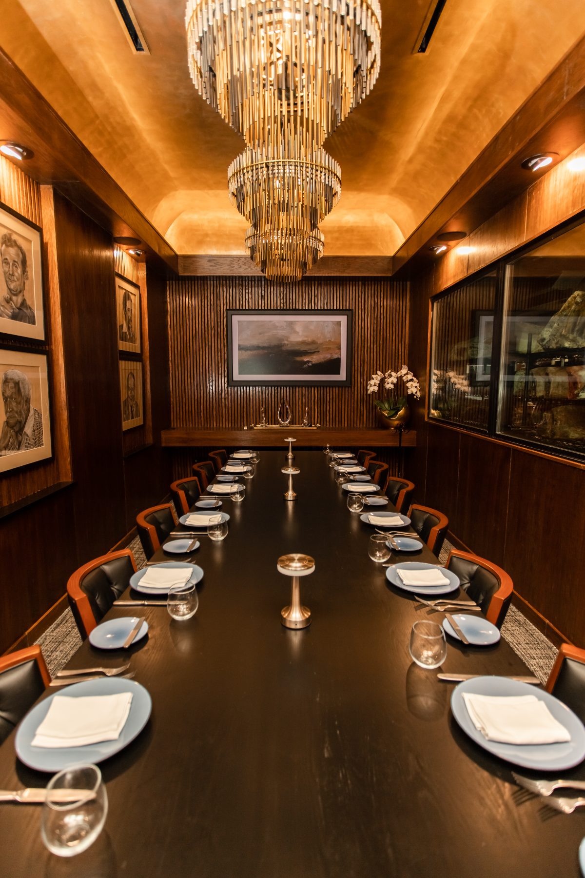 The Butcher Room private dining table with a window into the dry-aging room