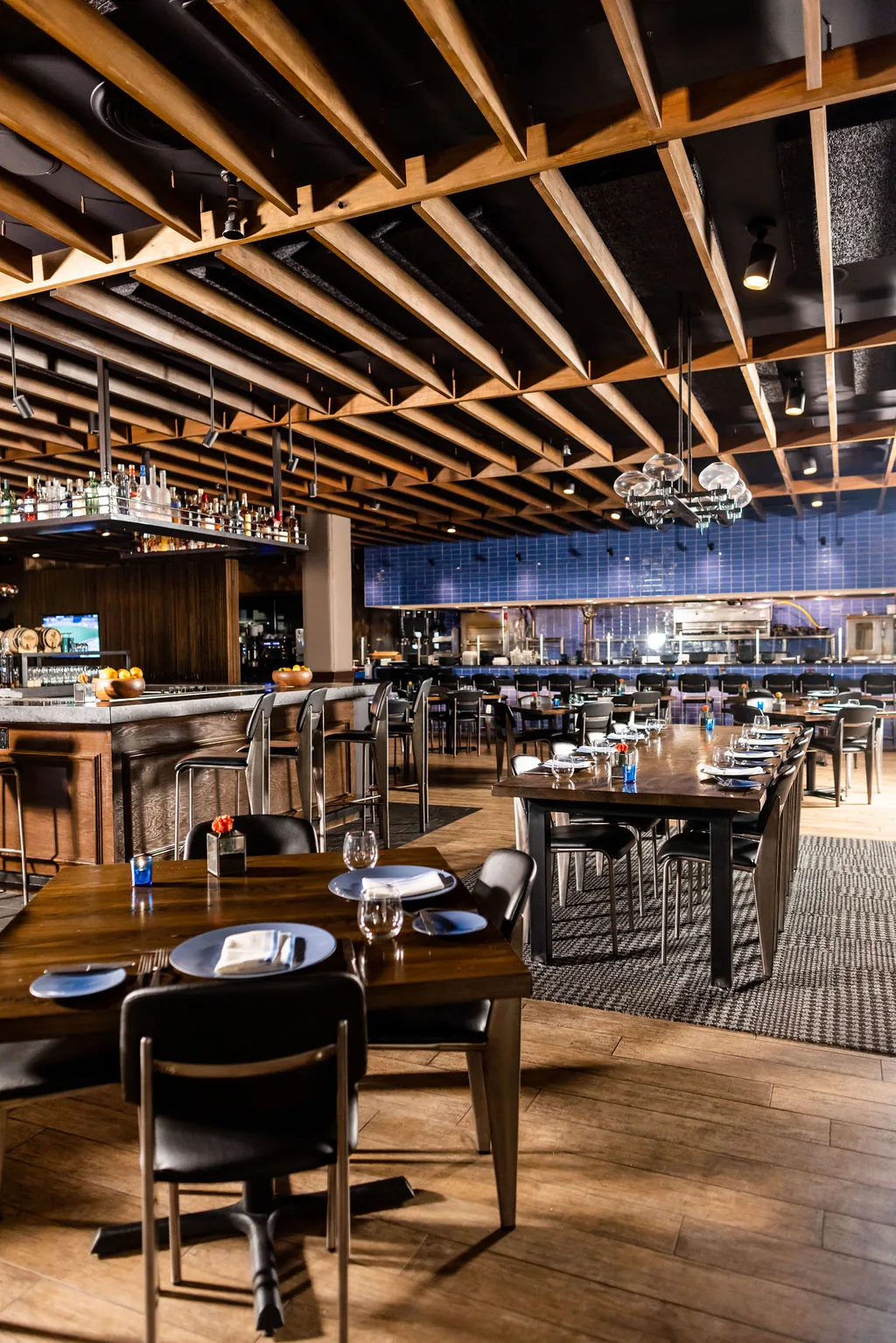The main dining room and open kitchen at Knife Steakhouse Plano