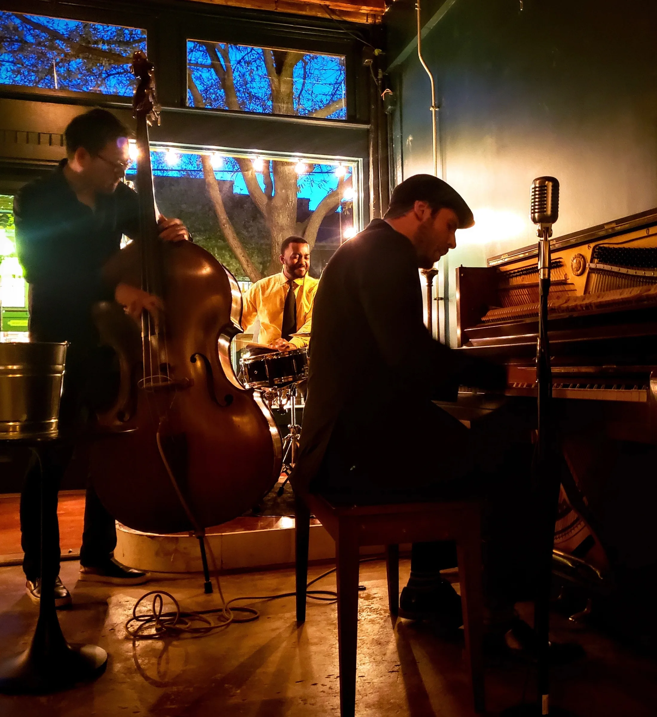 A jazz trio performing at Knife Steakhouse Plano